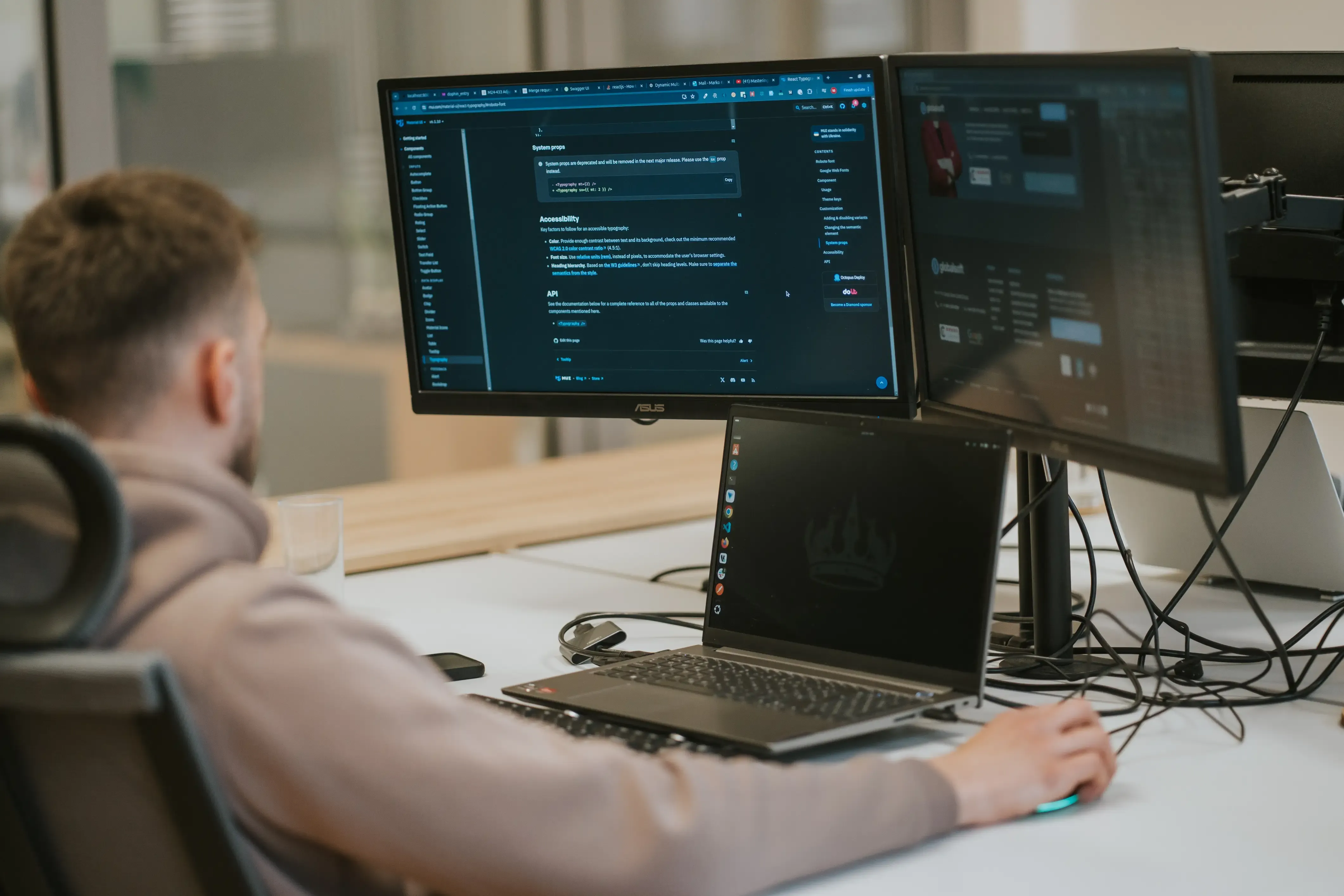 Developers working on code at his workstation