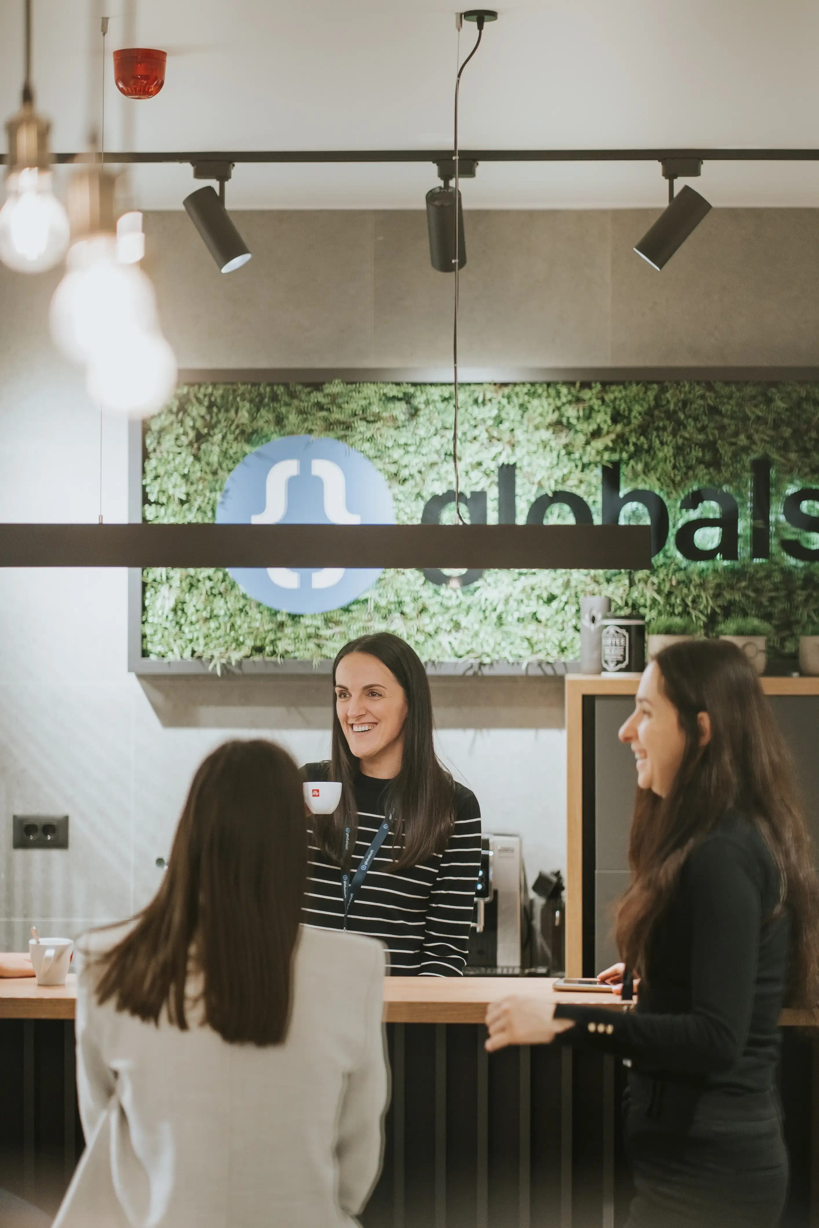 Team members discussing during coffee break